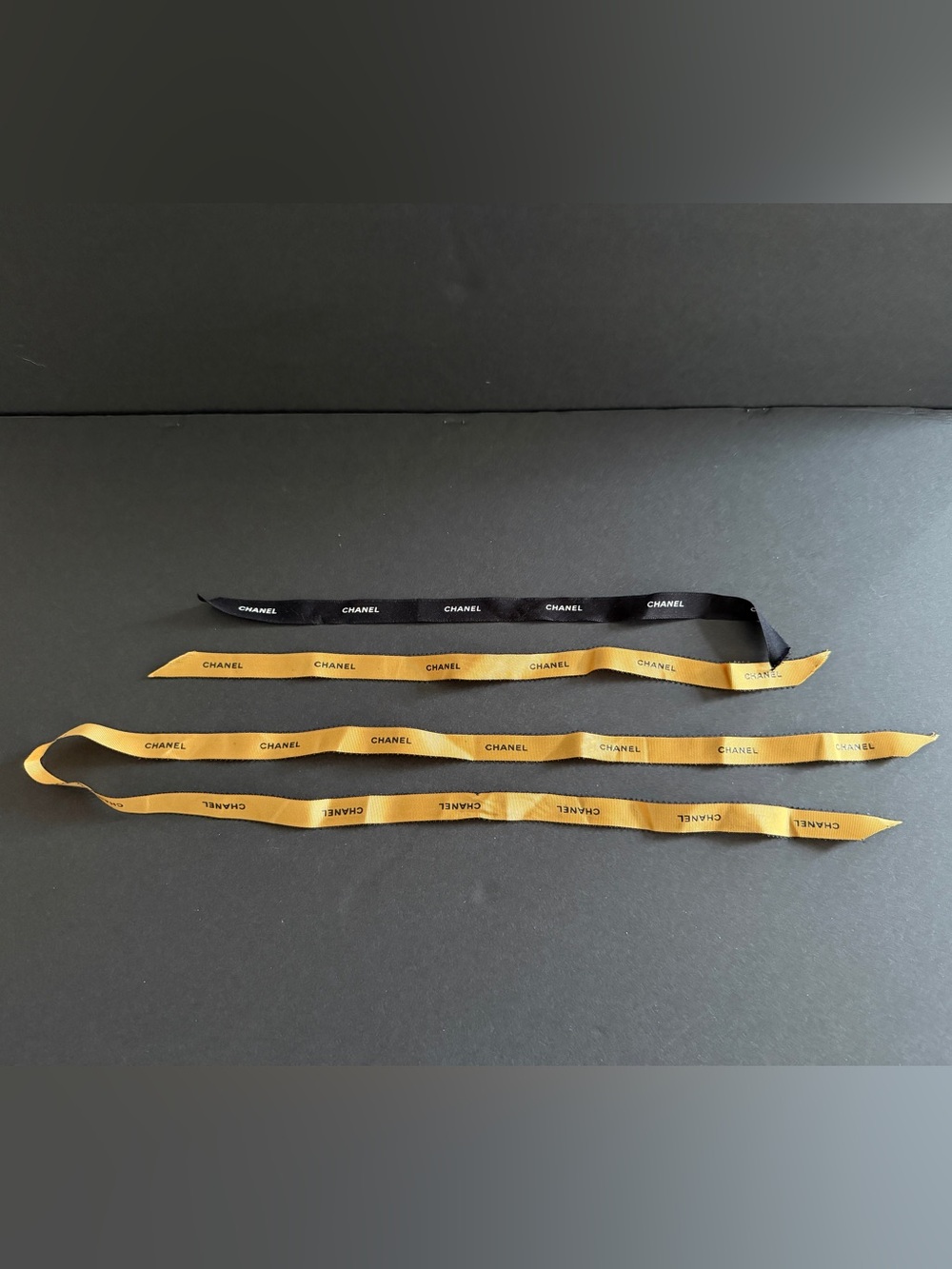 CHANEL Black and Gold Branded Ribbon Strips